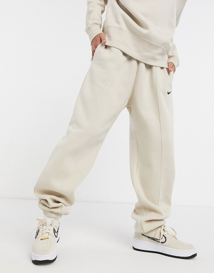 Nike mini swoosh oversized sweatpants in cream - CREAM - ShopStyle  Activewear Pants