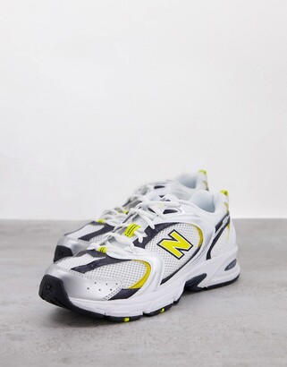 New Balance 530 trainers in white yellow and navy - ShopStyle
