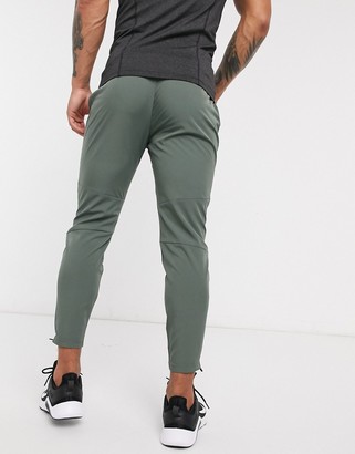 ASOS 4505 woven skinny tapered running joggers with reflective zip detail in khaki
