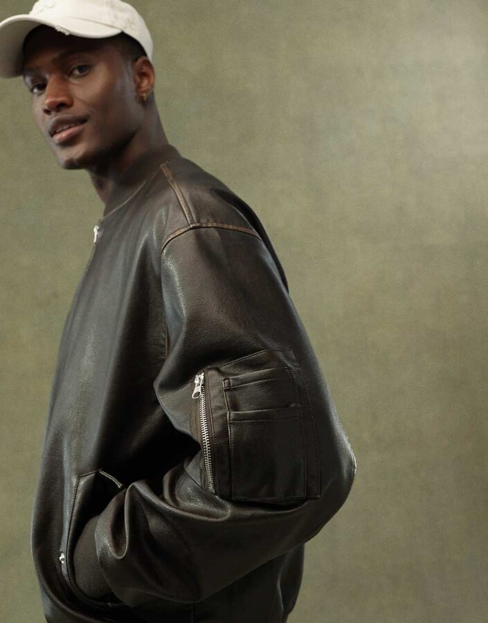 ASOS DESIGN faux leather oversized distressed bomber jacket in