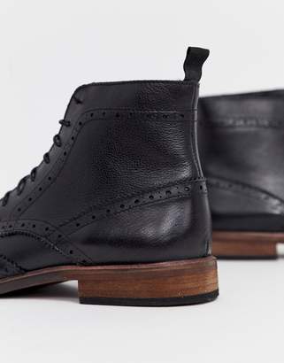 ASOS Design DESIGN brogue boots in black leather with natural sole