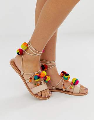 ASOS Design DESIGN Fun Fair pom pom leather tie leg flat sandals-Beige