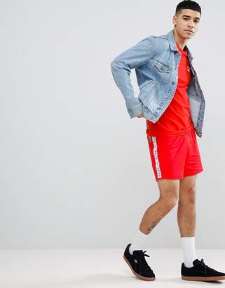 Puma shorts with taped side stripe in red Exclusive at ASOS