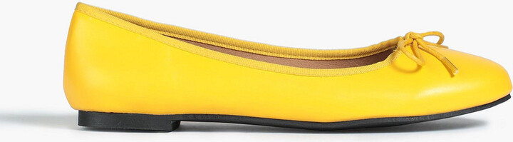 yellow flat pumps