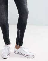 Thumbnail for your product : New Look Skinny Jeans With Rips And Zip Hem In Washed Black