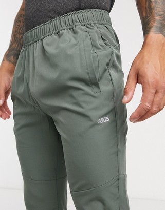 ASOS 4505 woven skinny tapered running joggers with reflective zip detail in khaki