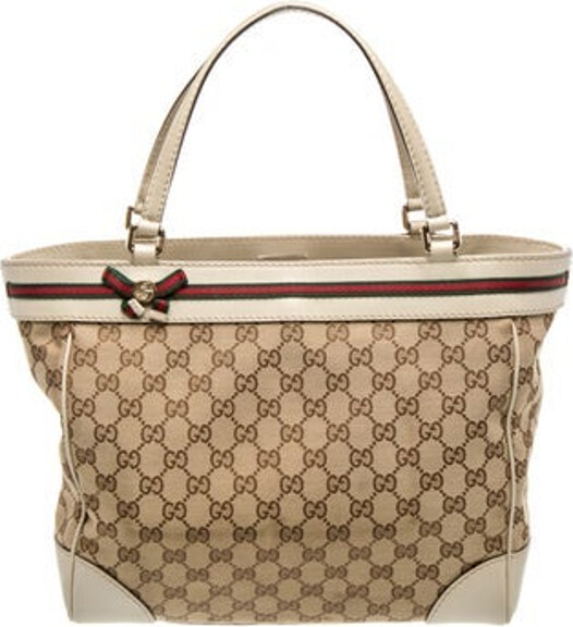 Gucci Top Handle Bag Neutrals Canvas GG Canvas, Web Accent, Interlocking G Logo & Princy Accent Gold-Tone Hardware Leather Trim Flat Handles & Dual Shoulder Straps Leather & Bow Accents Canvas Lining & Three Interior Pockets Snap Closure at Top Protective Feet at Base Includes Dust Bag