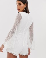 Thumbnail for your product : Starlet embellished plunge front playsuit with tassels in white
