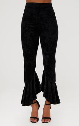 PrettyLittleThing Petite Black Velvet Flare Hem Trousers