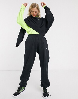 Nike mini Swoosh oversized joggers in black - ShopStyle Activewear