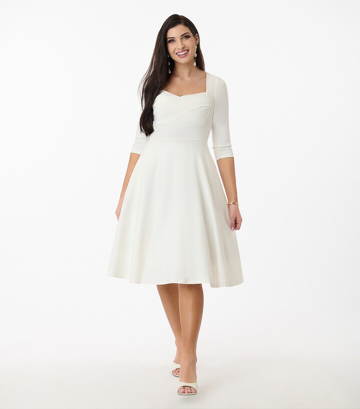 Unique Vintage 1950s Ivory Pleated Bust Swing D ress