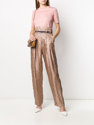 Fendi high-waisted Karligraphy motif printed trousers