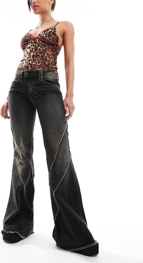 Minga London distressed flare jeans in washed black overdye - Main Image
