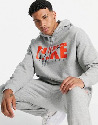 Nike graphic logo fleece tracksuit in grey - ShopStyle Chinos & Khakis
