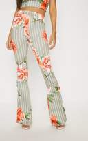 Thumbnail for your product : PrettyLittleThing Black Printed Slinky Flare Trouser