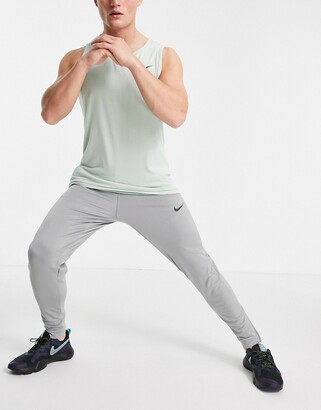 Nike Training Nike Pro Training joggers in grey - ShopStyle Trousers