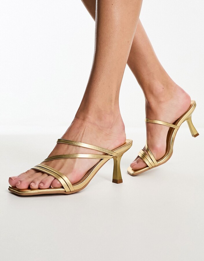 ASOS DESIGN Hartley strappy mid sandal heeled mules in gold - ShopStyle