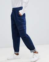 Thumbnail for your product : ASOS DESIGN tapered jeans with curved seam in indigo wash with utility pockets