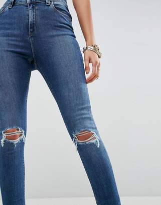 ASOS Design Ridley High Waist Skinny Jeans In Corinne Dark Wash With Rips And Busts