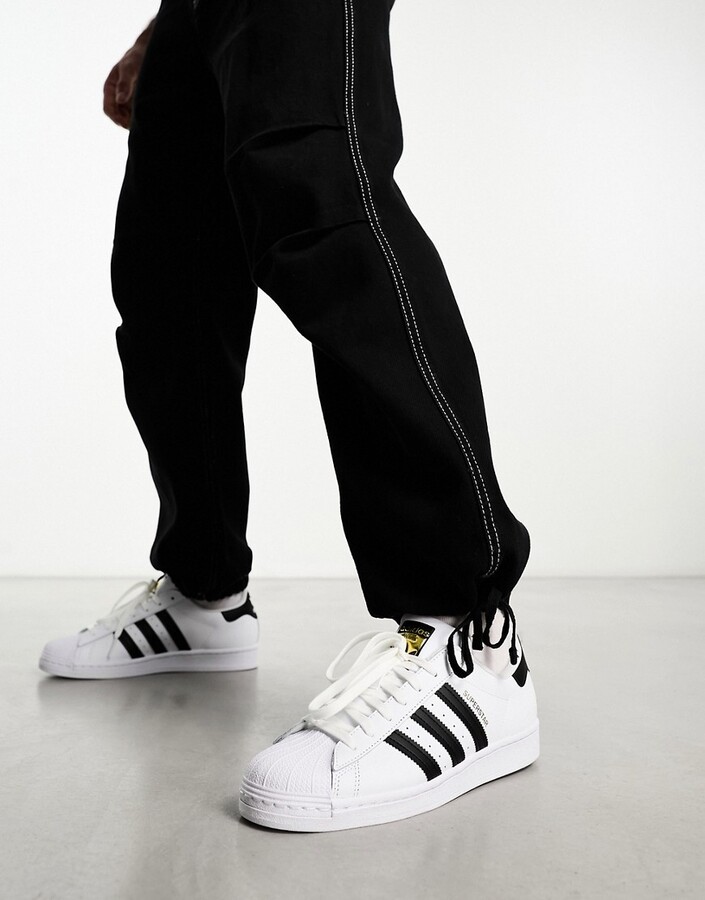 adidas Superstar sneakers in white and black - ShopStyle