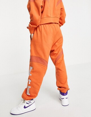 Nike Air oversized fleece joggers in orange - ShopStyle Trousers