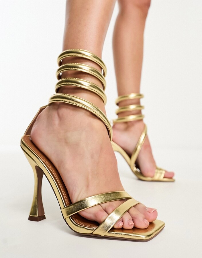 ASOS Design Hitched Bow Detail Mid Heeled Sandals in Gold