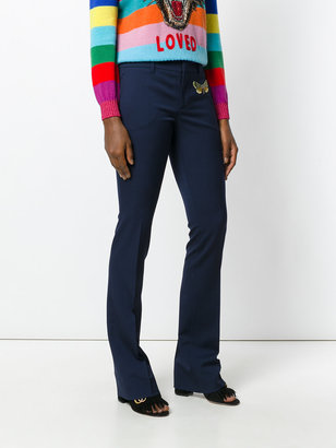Gucci moth embroidered flared trousers
