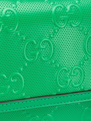 Gucci embossed GG motif messenger bag