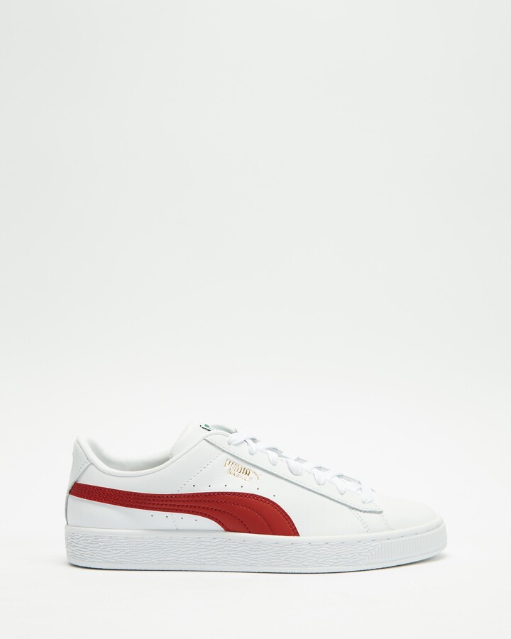 red and white puma trainers