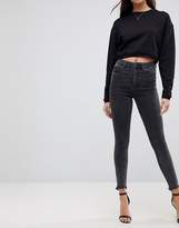 Thumbnail for your product : ASOS DESIGN Ridley high waist skinny jeans in mottled black with raw hem