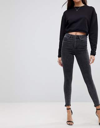 ASOS DESIGN Ridley high waist skinny jeans in mottled black with raw hem