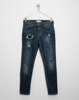 Thumbnail for your product : Topman organic cotton blend skinny jeans with repair patches in mid blue