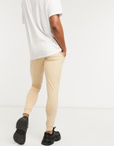 Thumbnail for your product : ASOS DESIGN co-ord lightweight super skinny joggers in beige