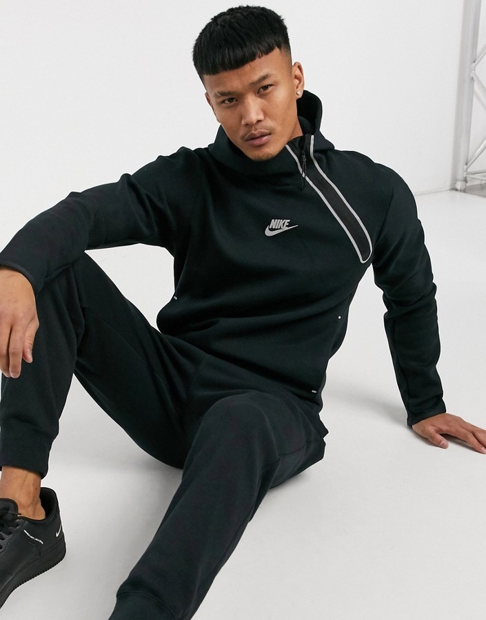 Nike Tech Fleece asymmetric half-zip hoodie in black - ShopStyle
