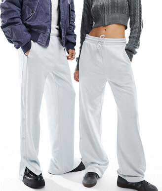 https://img.shopstyle-cdn.com/sim/bf/19/bf19829ef737d8e1ff76d15cfbe00a8a_xlarge/weekday-unisex-raheem-sweatpants-with-side-snaps-in-silver-gray-exclusive-to-asos.jpg