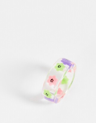 ASOS DESIGN DESIGN Curve ring with novelty flowers in clear plastic