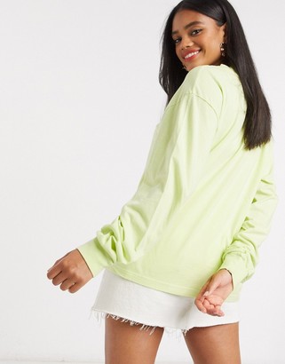 ASOS DESIGN oversized long sleeve t-shirt with cuff detail in washed lime