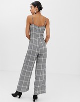 Thumbnail for your product : UNIQUE21 checked jumpsuit with buttons and waist belt