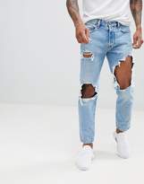 Thumbnail for your product : Diesel Mharky 90s slim fit distressed jeans in 0076m light wash