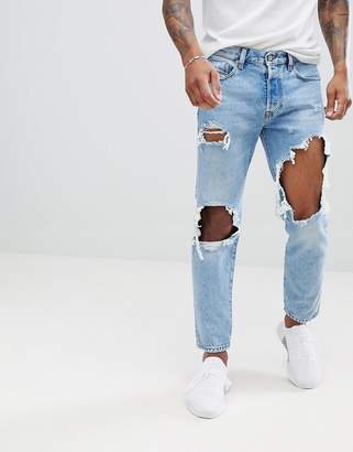 Diesel Mharky 90s slim fit distressed jeans in 0076m light wash