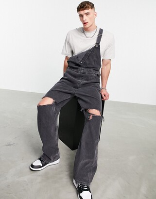 ASOS DESIGN baggy denim overalls in washed black with knee rips - ShopStyle  Loose Jeans