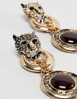 ASOS DESIGN statement earrings with lionhead and stone disc pendant in gold