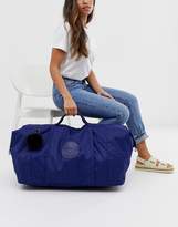 Thumbnail for your product : Kipling blue large holdall bag with black fluffy charm