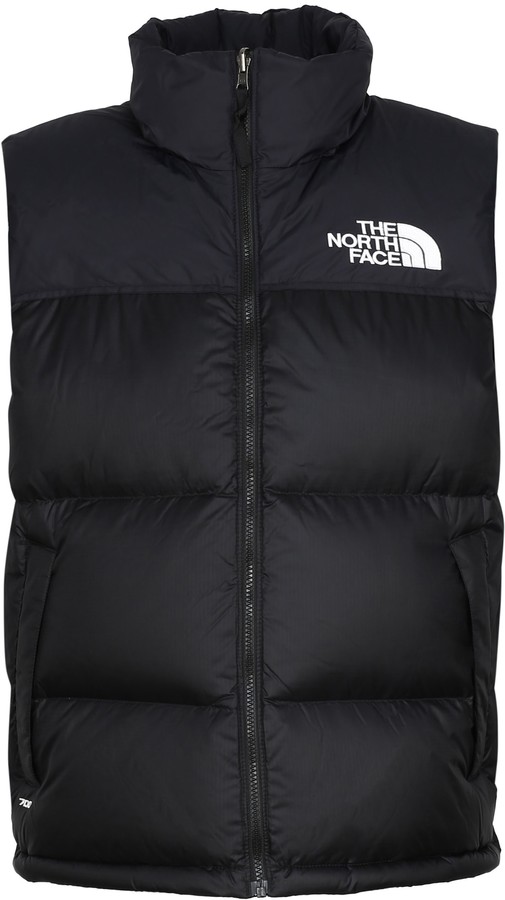 red and black north face body warmer