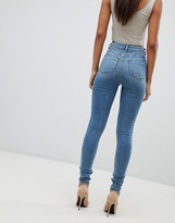 Thumbnail for your product : ASOS Tall DESIGN Tall high rise ridley 'skinny' jeans in pretty mid stonewash