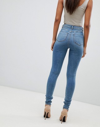 ASOS Tall DESIGN Tall high rise ridley 'skinny' jeans in pretty mid stonewash