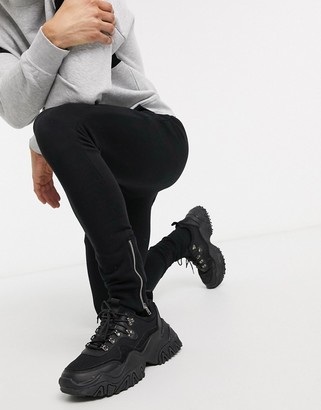 ASOS DESIGN super skinny joggers in black with silver zip cuffs