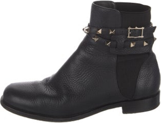 Valentino Leather Ankle Chelsea Boots Black Rockstud Accents Round-Toes with Studded Accents Wrap-Around Straps & Buckle Closure at Sides Includes Dust Bag
