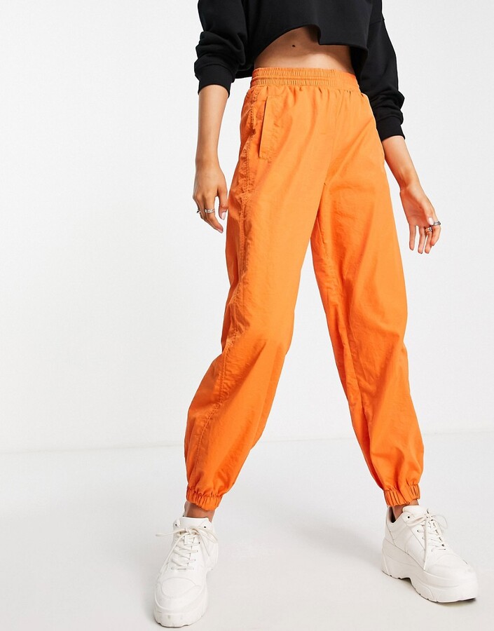 Bershka nylon cargo parachute trousers in orange ShopStyle