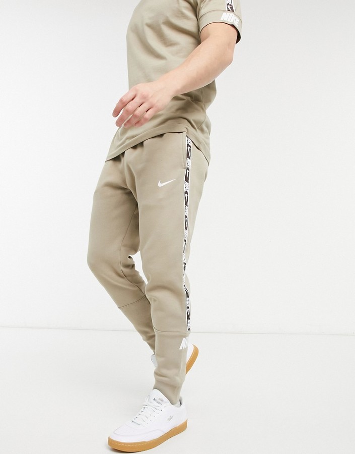 Nike Repeat Pack taping cuffed sweatpants in dusty khaki - ShopStyle  Activewear Pants